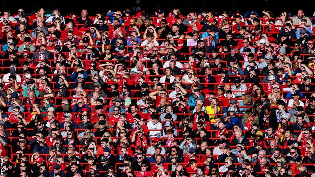 Liverpool fans watch a game against Brighton at Anfield in the safe standing area in 2022