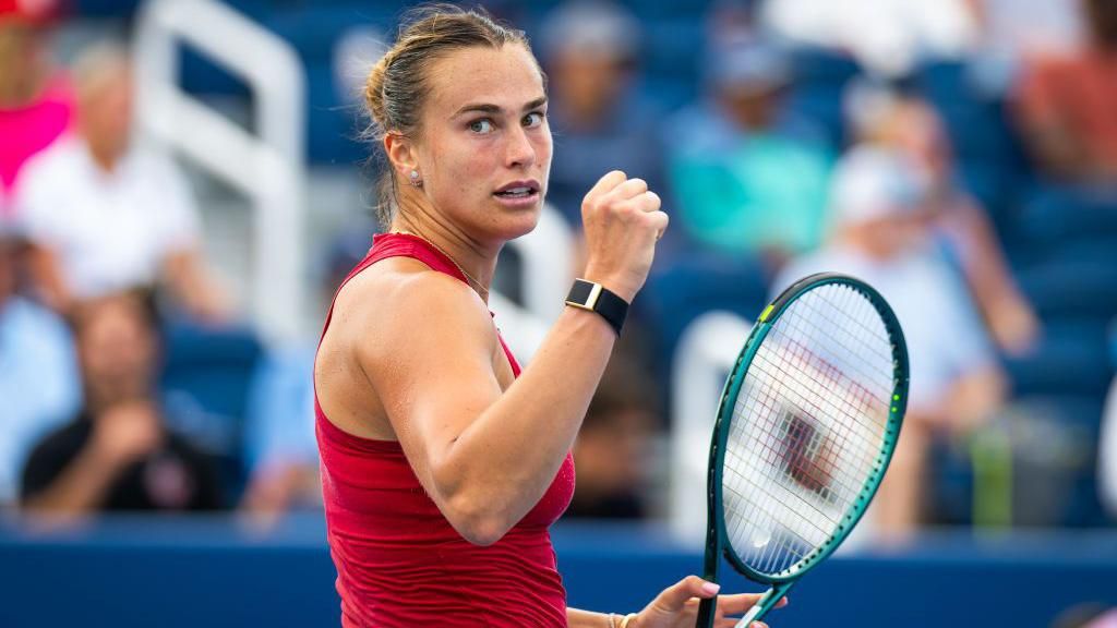 Aryna Sabalenka clenching her fist in celebration