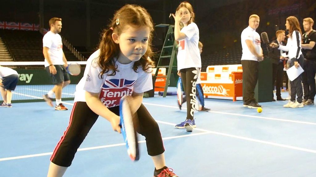 A girl taking part in a Tennis for Kids session