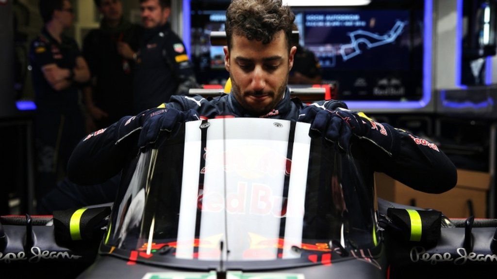 Daniel Ricciardo climbs into the Red Bull car fitted with "aeroscreen"