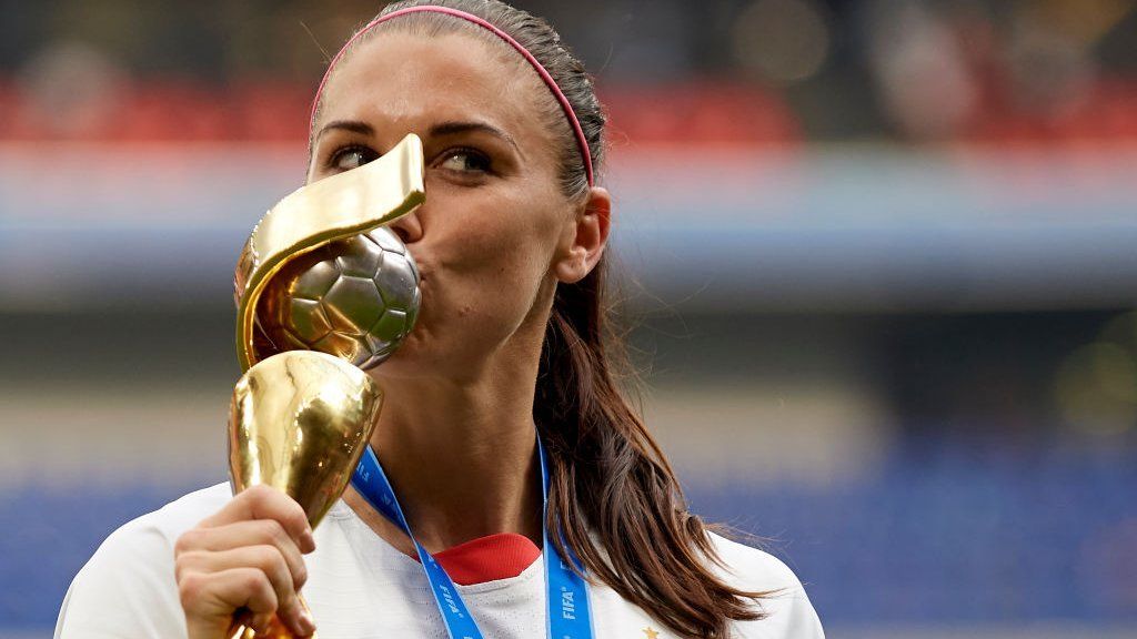 Alex Morgan of the USA kisses the Women's World Cup trophy