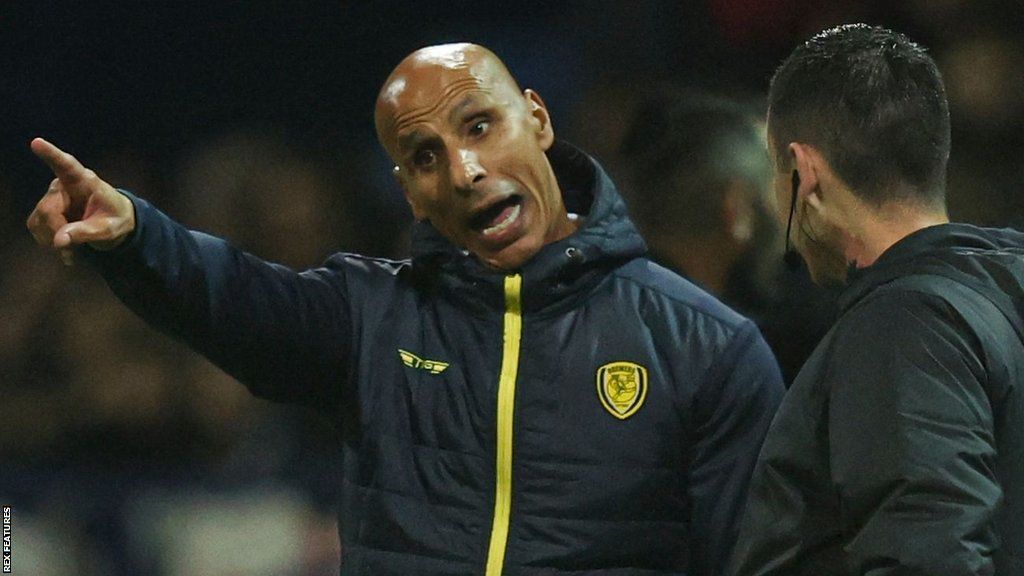 Burton boss Dino Maamria makes a point to the fourth official