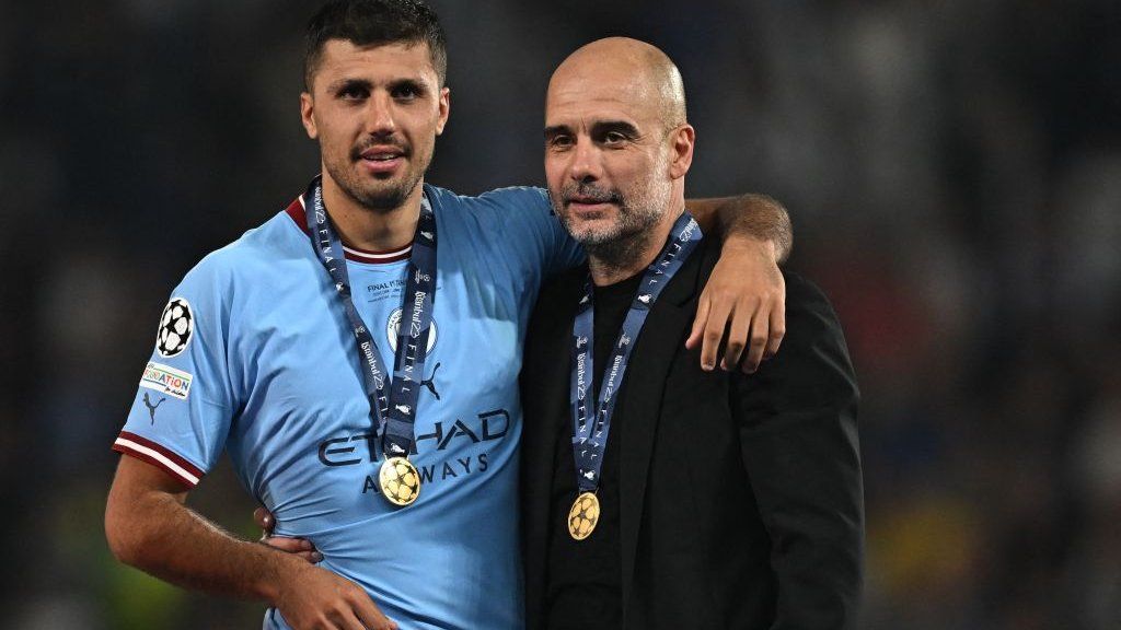 Rodri and Pep Guardiola celebrate after Manchester City's Champions League win