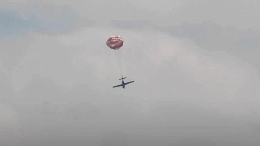 Plane with parachute