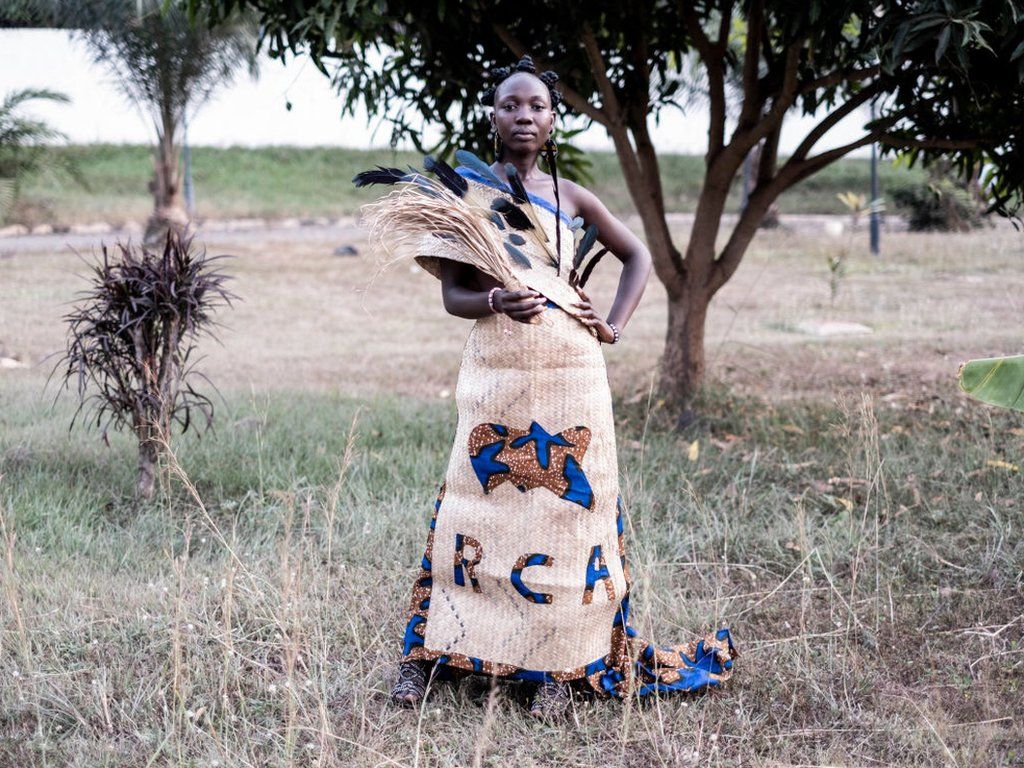 A model poses with a creation by Victoire Kouroupe, a local designer and head of "KJV creation", ahead of the first Central African Fashion Week at the Ledger Hotel in Bangui, 17 December 2022.