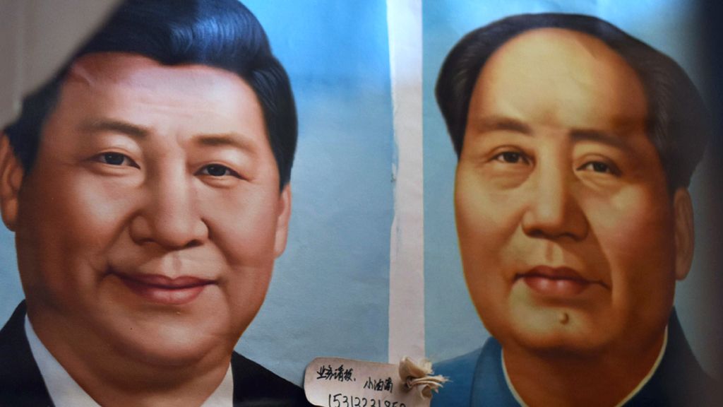Painted portraits of Chinese President Xi Jinping and late communist leader Mao Zedong