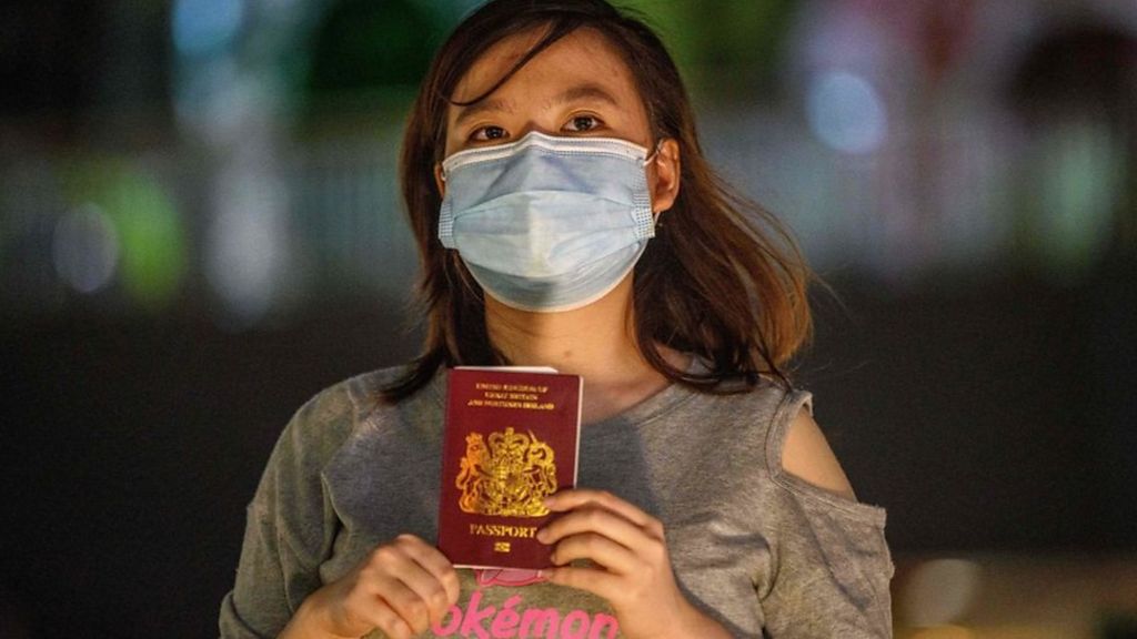 Woman holding BNO passport