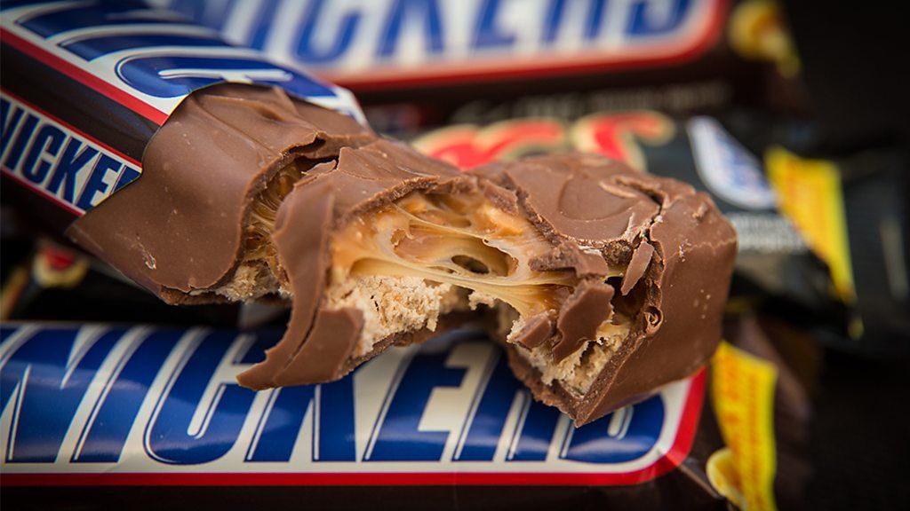 A snickers bar broken in two