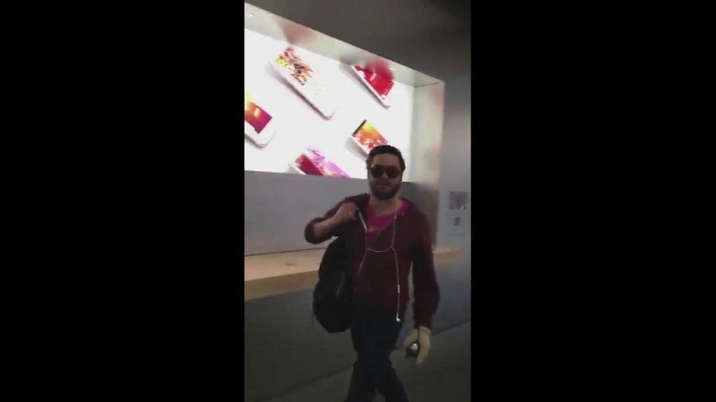 The man - apparently unhappy at Apple's customer service - can be seen walking around the store destroying the expensive phones in Dijon, France