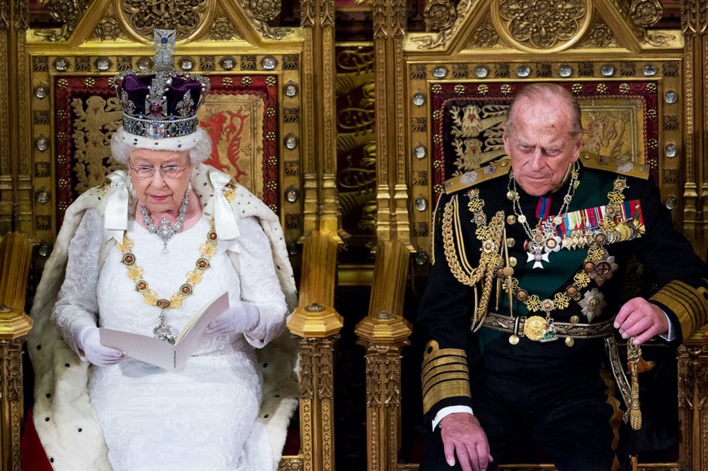 The Queen, with the Duke of Edinburgh by her side, wearing the crown at the State Opening of Parliament in 2016