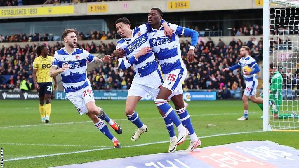 Reading players celebrate after scoring their equaliser