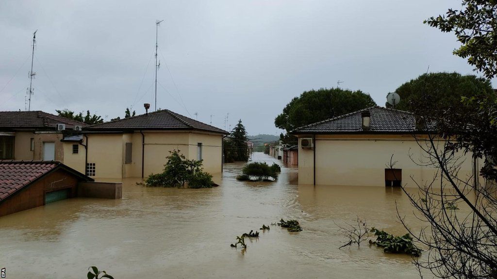 Buildings submerged under water in Faenza, Italy