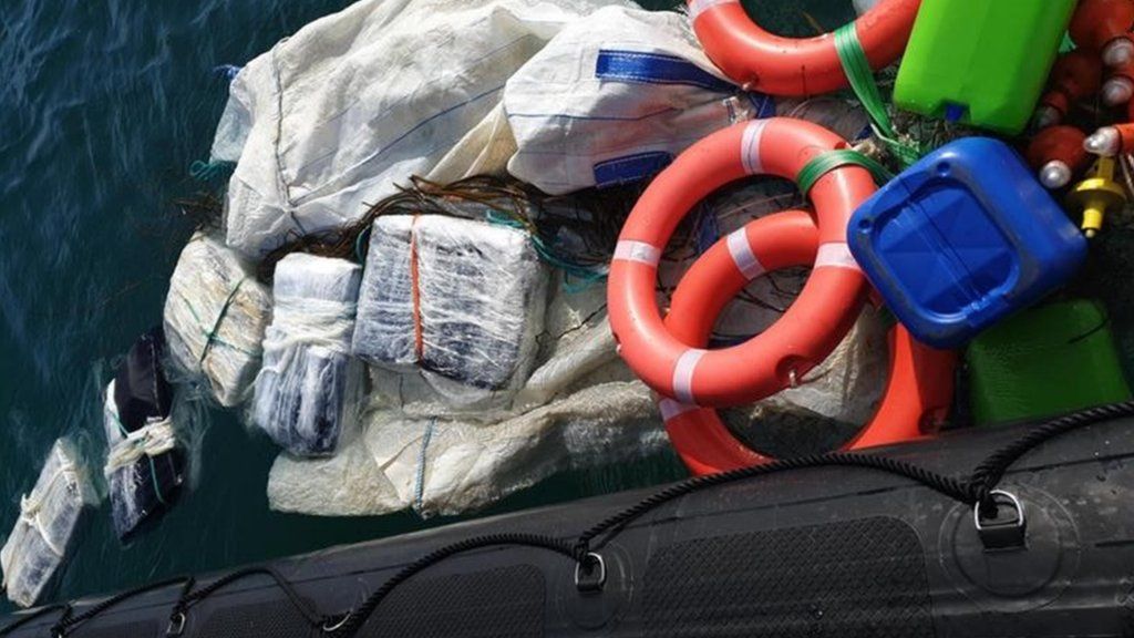 Packages of drugs being recovered from the sea