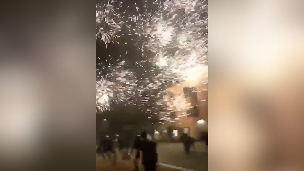 Firework exploding close to people
