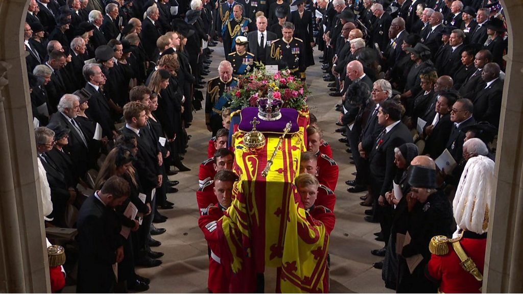 Queen's coffin is carried through St George's Chapel