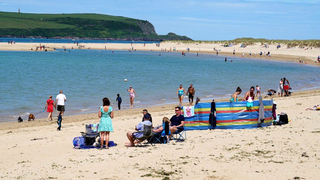 Holiday-makers on the beach on July 12, 2020 in Rock, United Kingdom