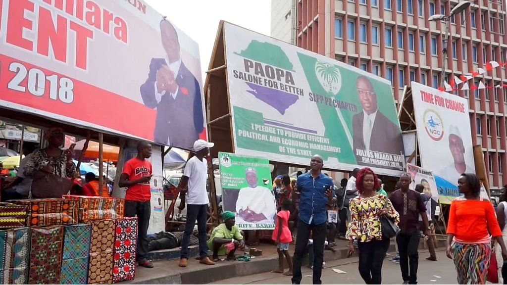 Billboards showing Sierra Leone presidential candidates