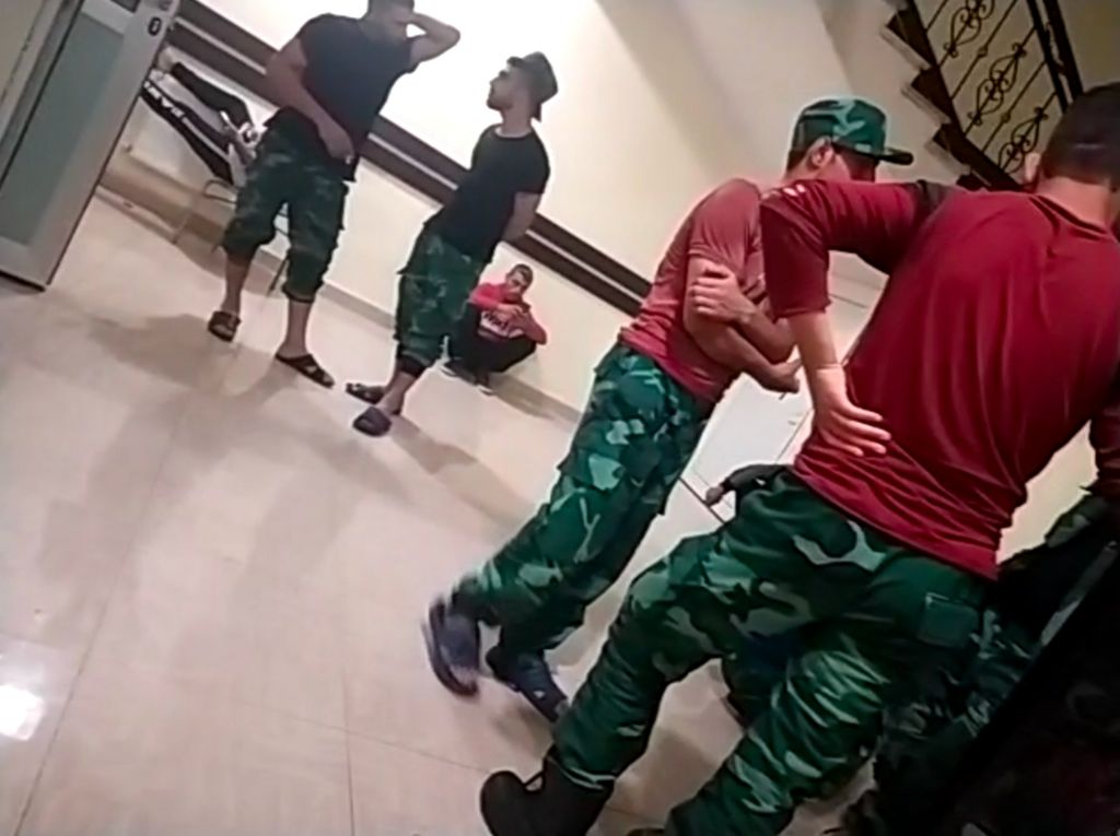 A shot apparently of Syrian fighters in a barracks in south-western Azerbaijan - they are wearing the aqua-tinted fatigues of the Azeri border guard service