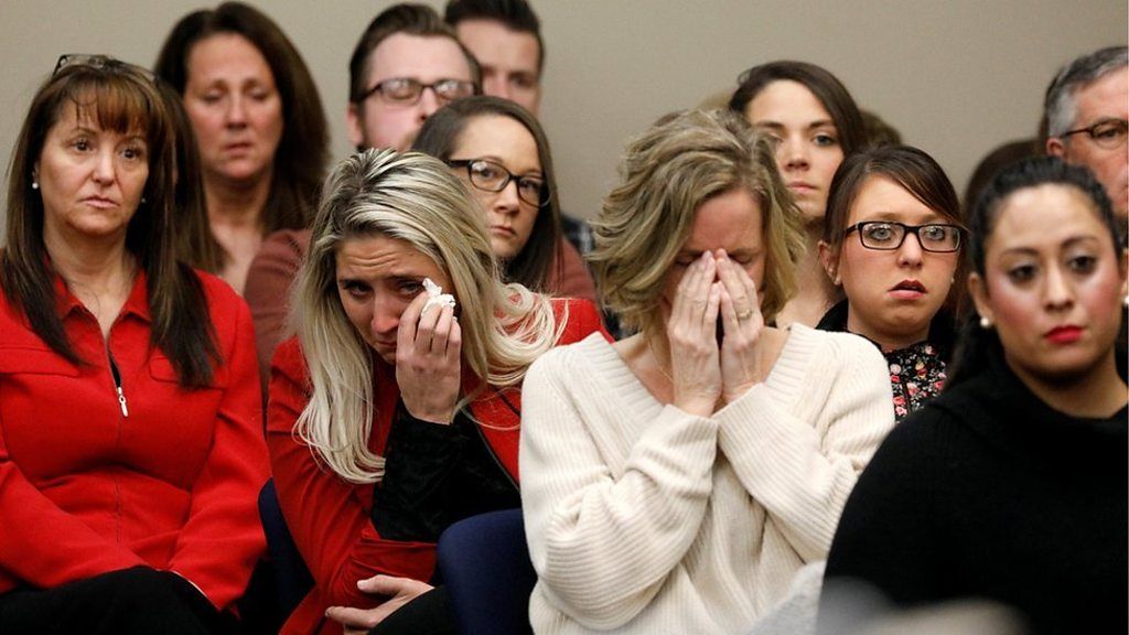 Women cry at the sentencing hearing for Larry Nassar