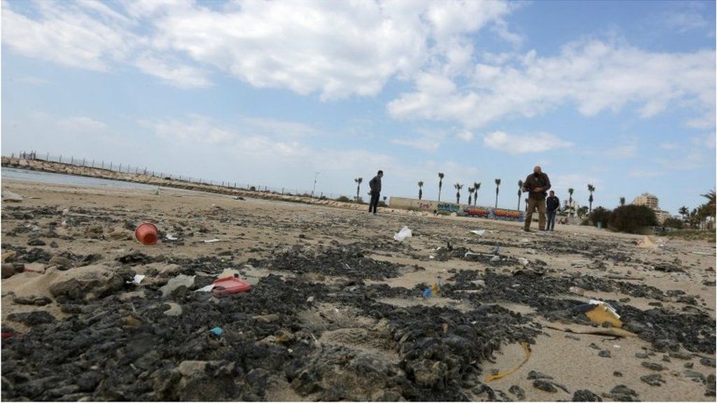 Tar is seen on the beach in the aftermath of an oil spill