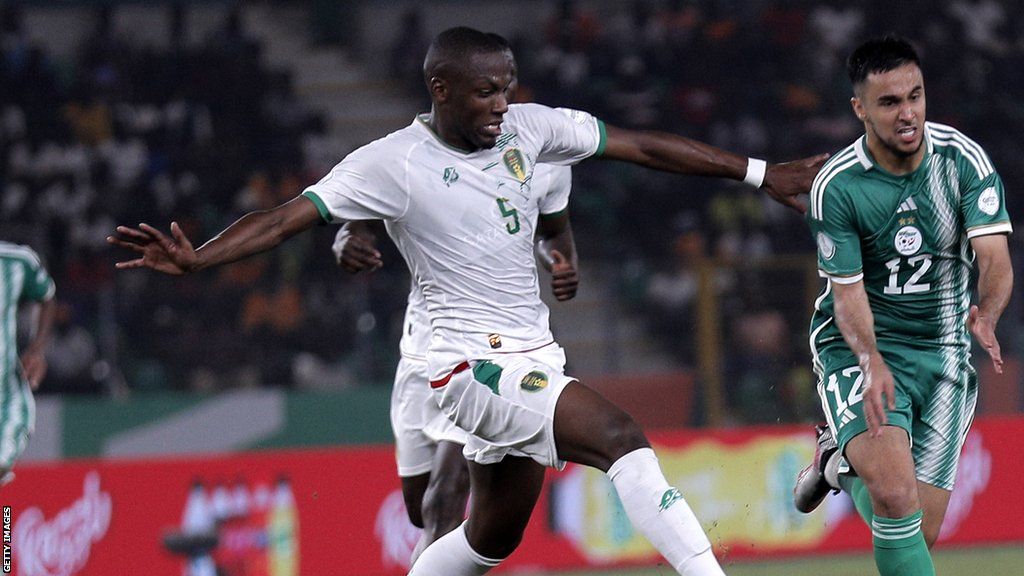 Algeria's Adam Mohamed Ounas with Lamine Ba of Mauritania during the 2023 Africa Cup of Nations Group D football match between Algeria and Mauritania in Ivory Coast