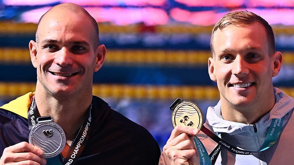 Caeleb Dressel holds off 42-year-old Nicholas Santos to retain 50m butterfly title