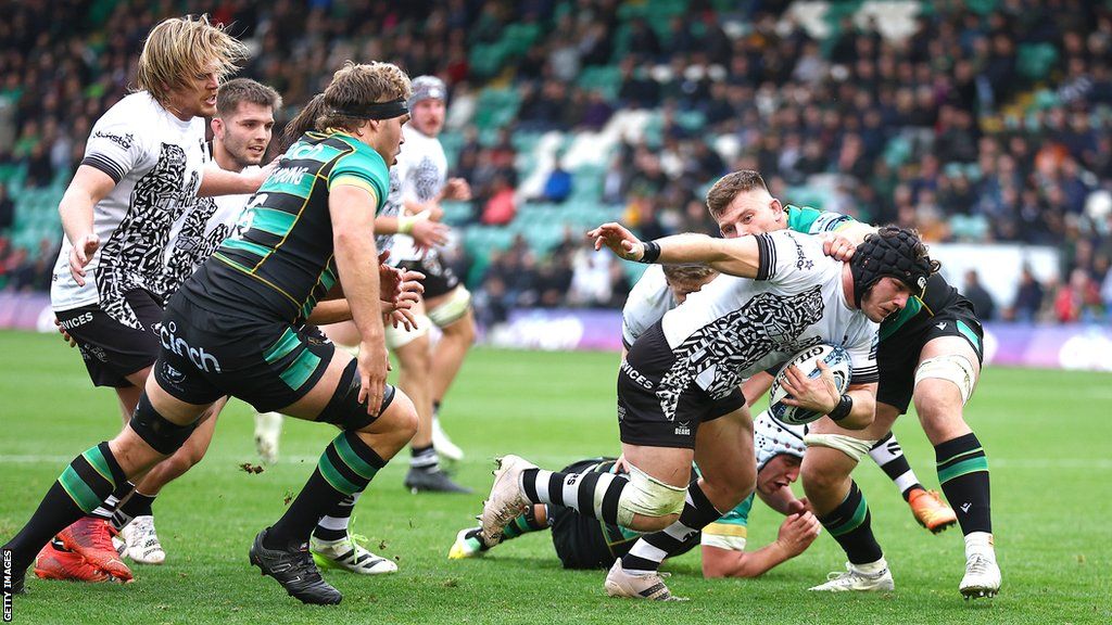 Harry Thacker goes through the Northampton defence to score a try for Bristol