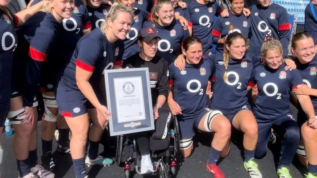 Lexi Chambers being given a world record certificate at Sandy Park in Exeter, by the England Women's rugby team