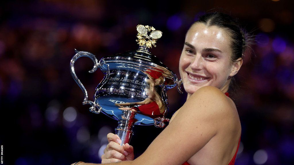 Aryna Sabalenka hugs the Australian Open trophy
