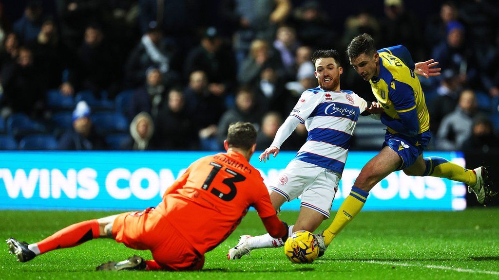 Paul Smyth (centre) playing for QPR against Stoke City