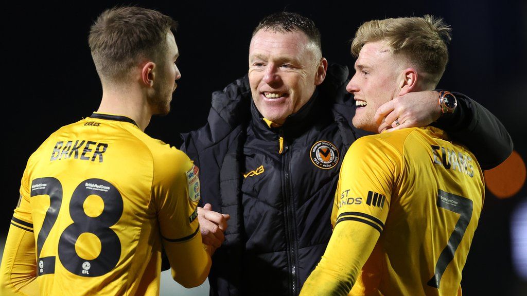 Newport County manager Graham Coughlan with Matthew Baker and Will Evans