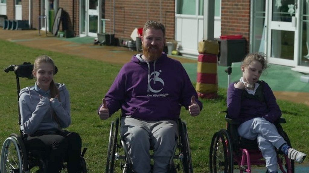 Peter Donnelly and some young wheelchair users