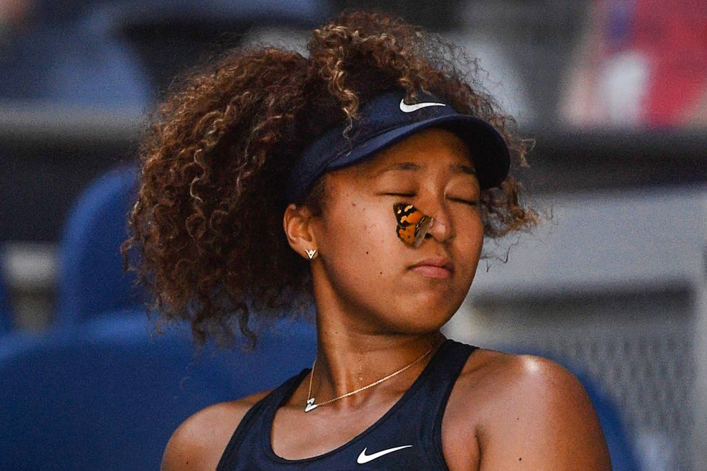 A butterfly on Naomi Osaka