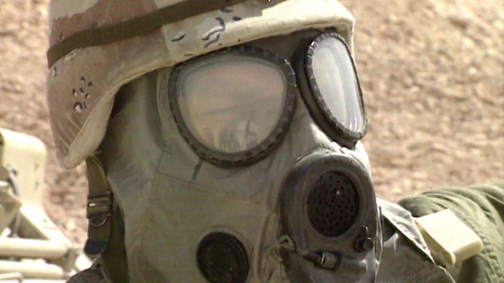 Soldier wearing gas mask