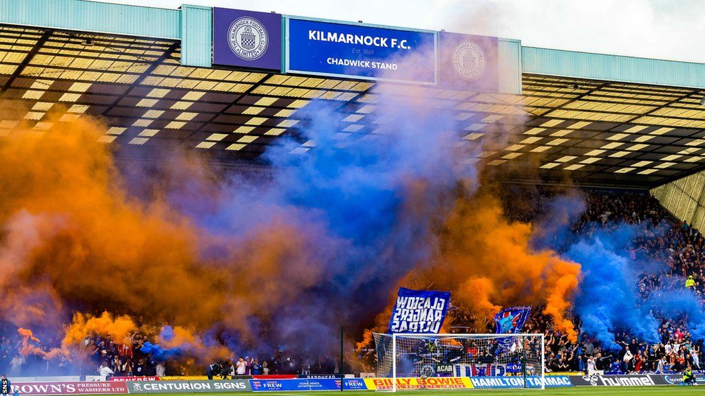 Rangers fans release blue and orange flares at Rugby Park