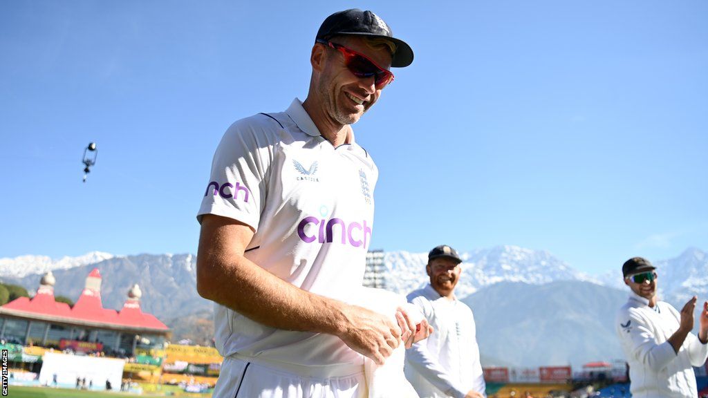 England bowler James Anderson smiles as he walks off after taking his 700th Test wicket
