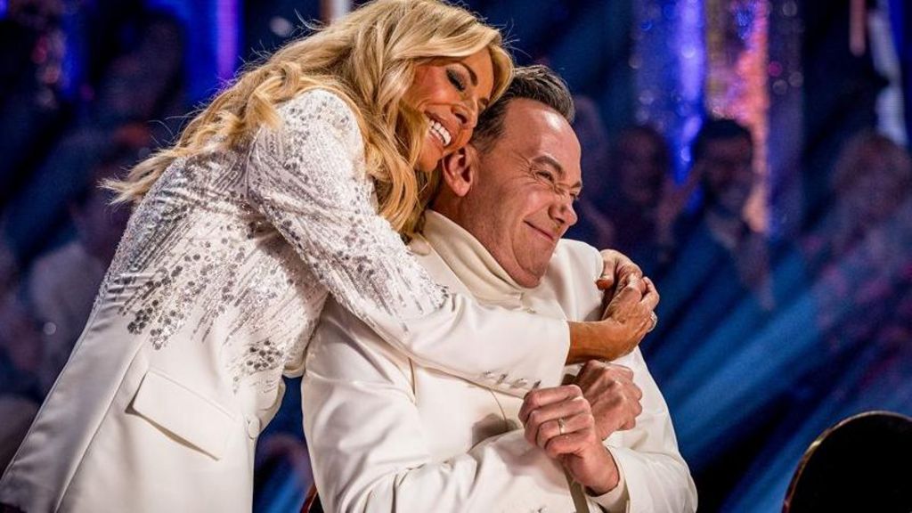 Tess Daly wraps her arms around Strictly judge Craig Revel Horwood to give him "a little snuggle"