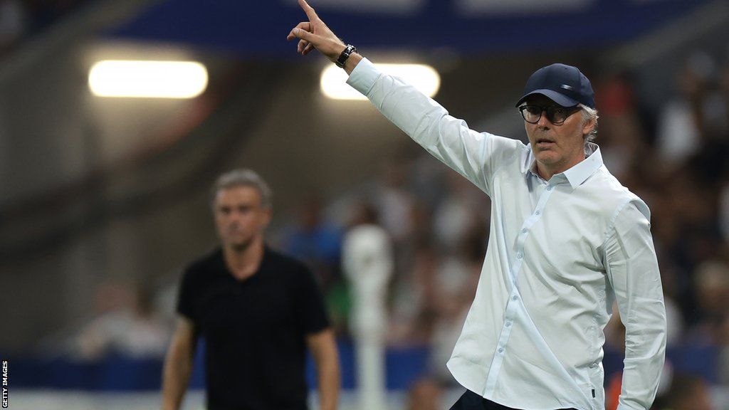 Laurent Blanc points on the touchline while managing Lyon