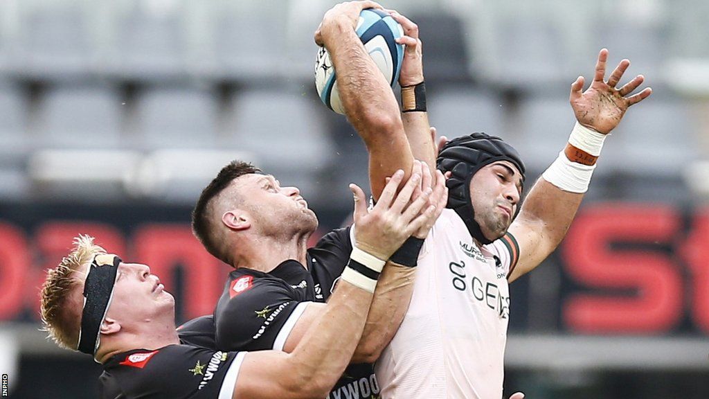 Connacht's Byron Ralston battles in the air with Sharks duo Cameron Wright and James Venter