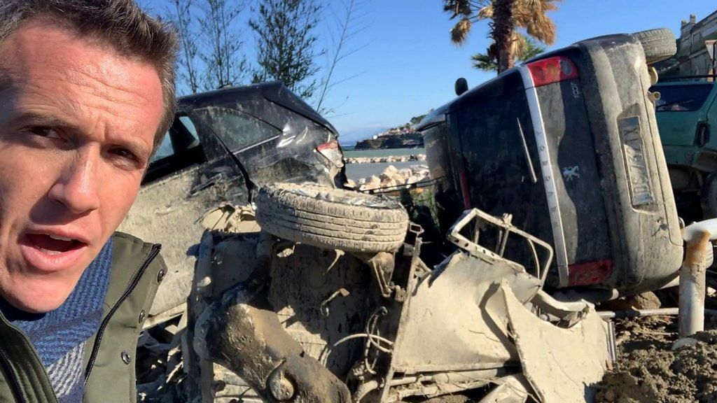 Mark Lowen with destroyed cars