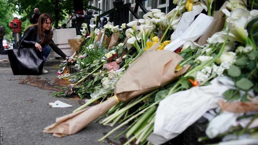 Flowers left outside the scene of the shooting in Belgrade