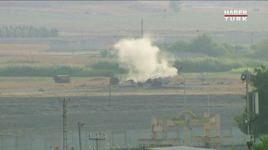Smoke billows in Syria's Ras al-Ain after Turkey launched an offensive