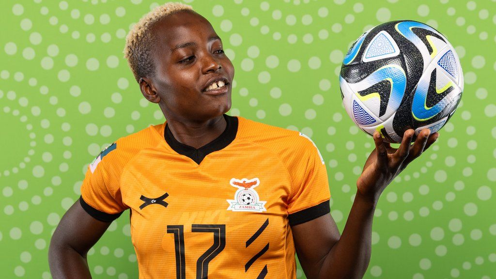 Racheal Kundananji poses in a Zambia shirt holding a ball before the 2023 Women's World Cup