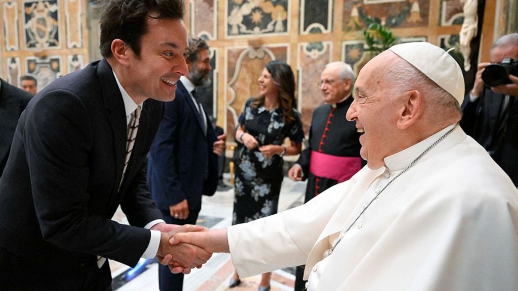 Pope Francis greets Jimmy Fallon as he meets with comedians during a cultural event at the Vatican, June 14, 2024