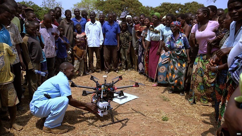 Health worker collecting medical supplies from a drone delivery