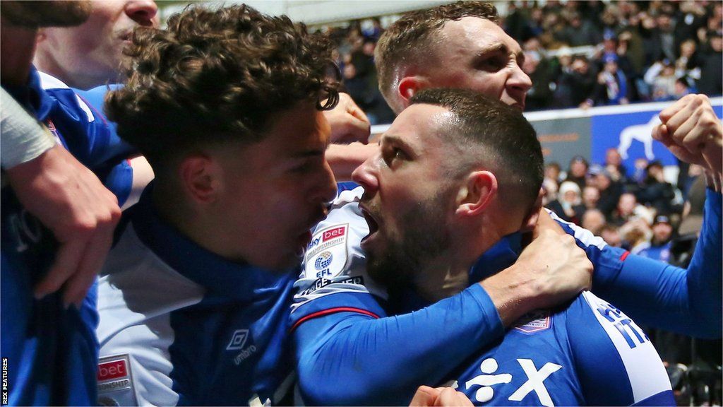 Conor Chaplin celebrates with Ipswich teammates