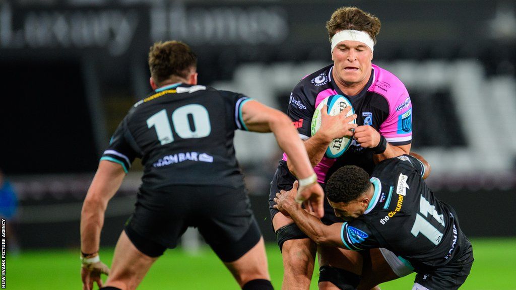Cardiff lock Teddy Williams is tackled by Ospreys defence during a pre-season friendly in October 2023