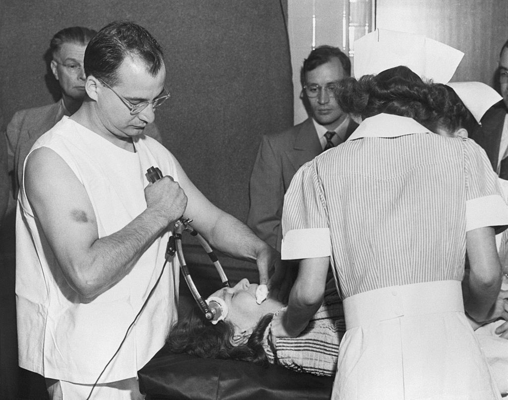 Freeman's colleague Dr James Shanklin uses electrical apparatus to prepare a patient for transorbital lobotomy