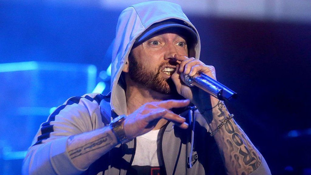 Eminem criticised after 'gunshot' sound effects cause panic at festival -  BBC News