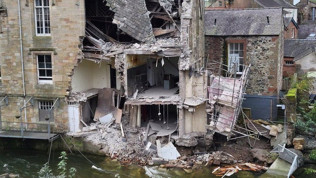 The damage to the rear of the building next to the river